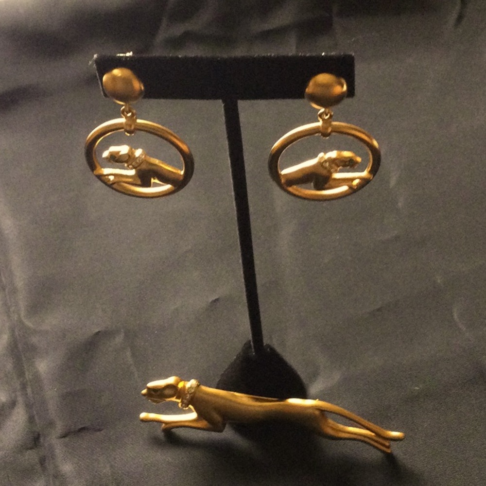 Jackie Collins signed vintage gold tone panther brooch and pierced earring set.